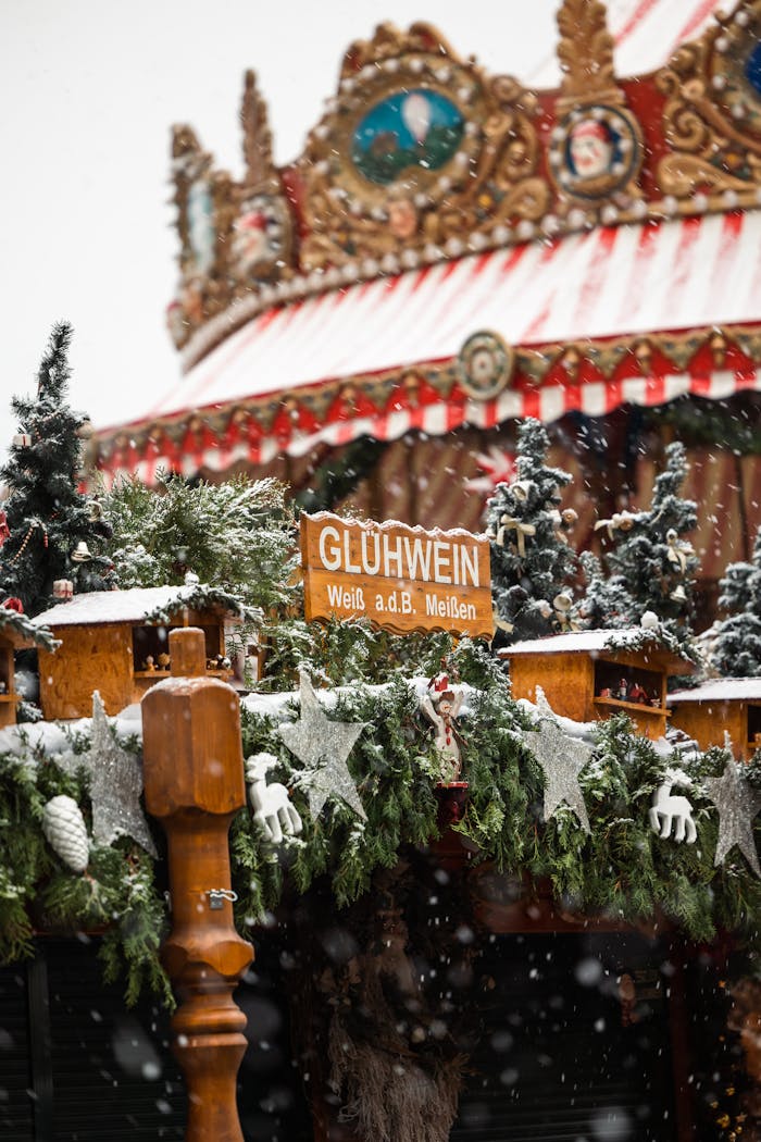 gallery-03 Snow falls on a festive stall selling Gluhwein at a Christmas market in Dresden, Germany.