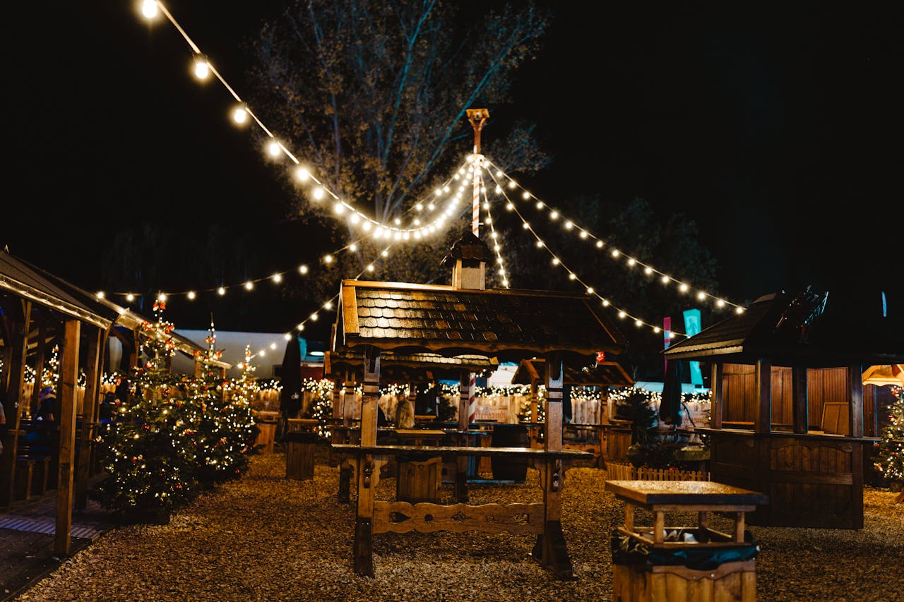 Enchanting Berlin Christmas market illuminated at night with festive decorations and lights.