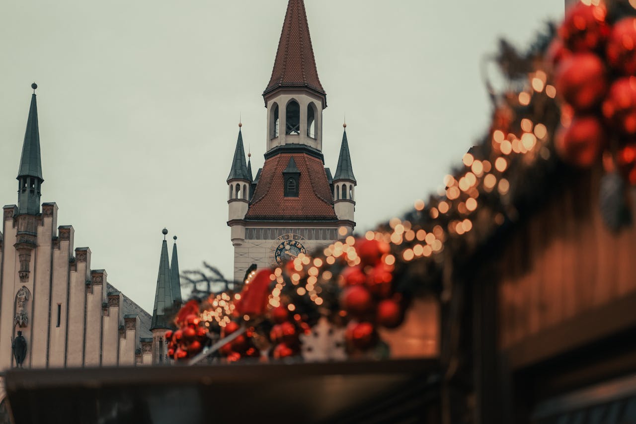 services-03 Festive Christmas market decorations with Munich architecture in the background.