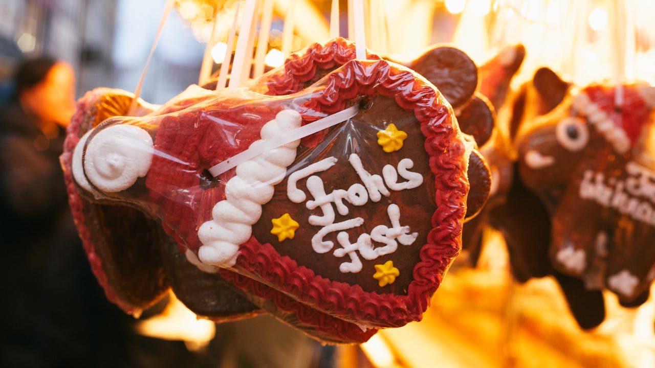 Festive gingerbread heart decorations at a Munich Christmas market, spreading holiday cheer.