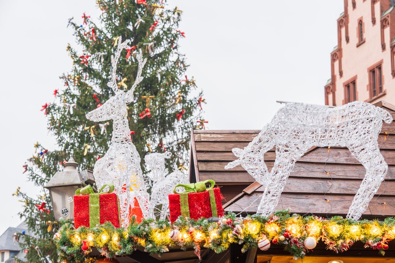 portfolio-07 Captivating Christmas market scene with glowing reindeer and festive decorations.